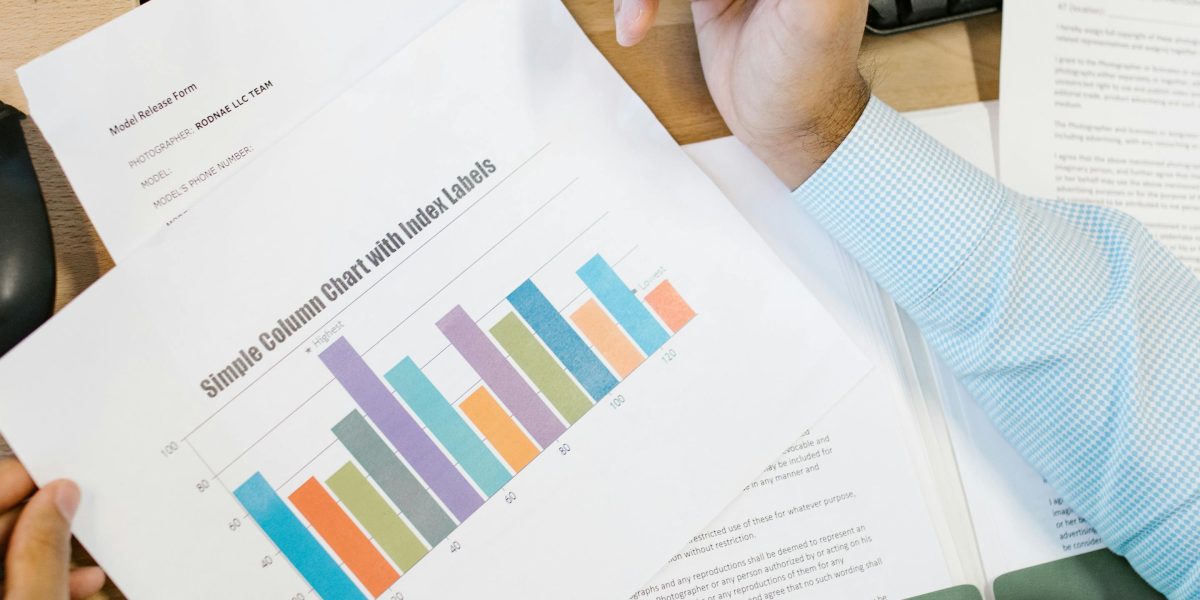 A dedicated professional immersed in financial reports, representing the effort required to understand complex market models.