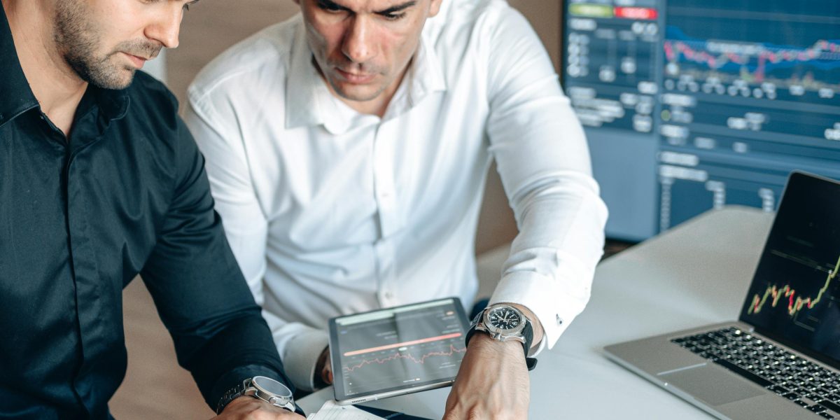 Professionals analyzing and discussing broader economic and industry trends.