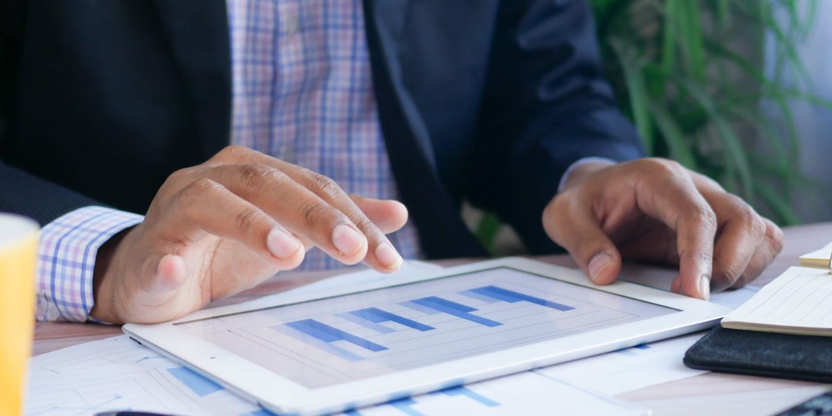 A professional reviewing financial reports, emphasizing the importance of data beyond online sentiment.