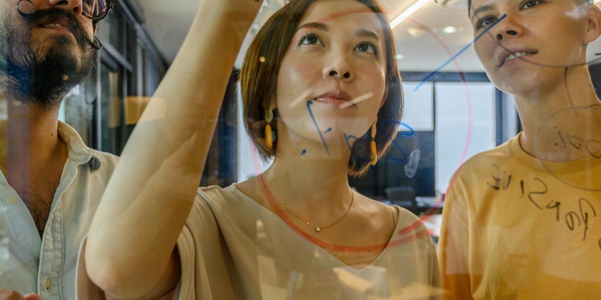 A creative team actively brainstorming, highlighting the human element in AI-assisted workflows.