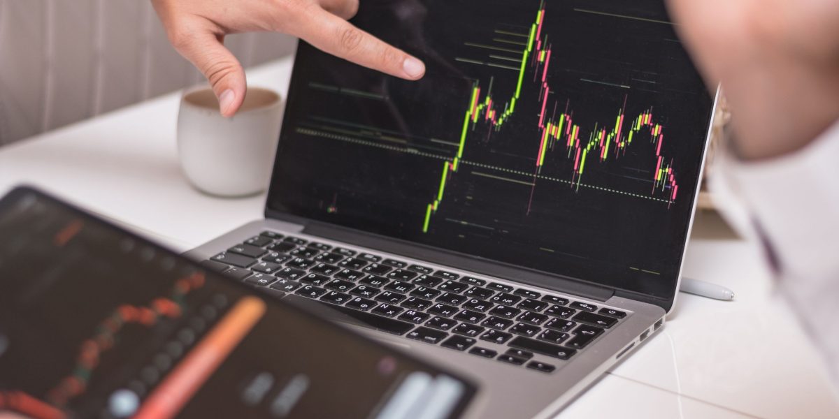 An investor thoughtfully reviewing investment documents, weighing potential high-risk, high-reward opportunities.