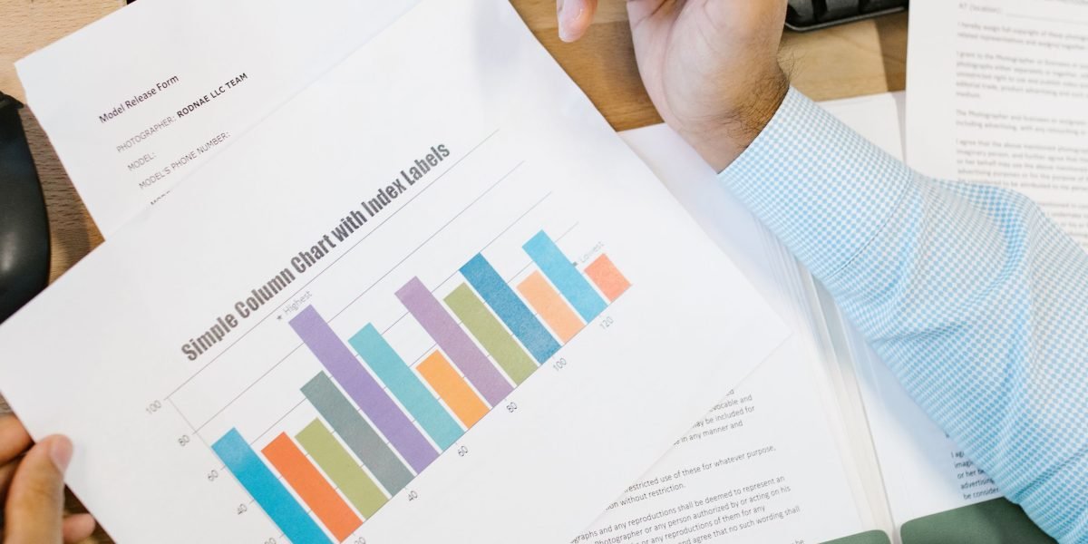 A professional confidently reviewing a financial report, reflecting clear and positive business momentum and performance.