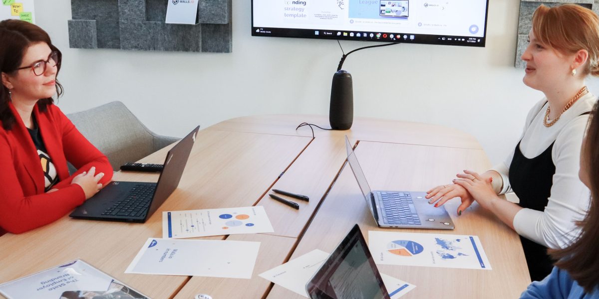 A diverse team engaged in a collaborative discussion, symbolizing innovation and product development in AI-driven solutions.