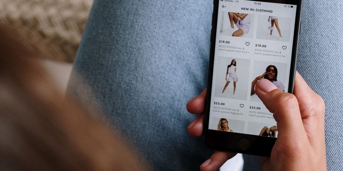 A person enjoying the convenience of online shopping on a mobile device.