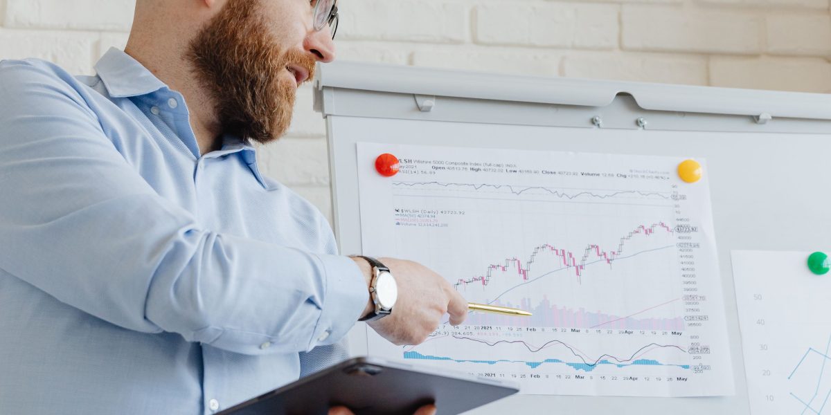 A person confidently reviews a diversified investment portfolio, reflecting strategic allocation.