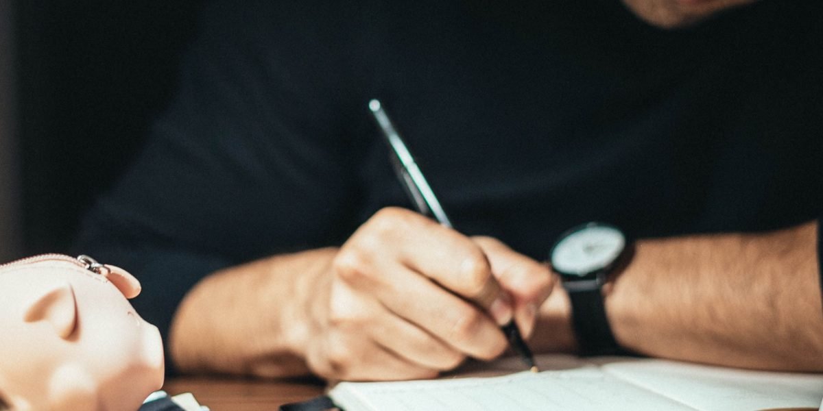 An individual thoughtfully considering and organizing a diverse financial strategy for a multi-sector portfolio.