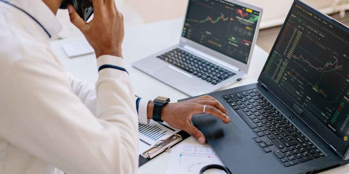 An individual focused on analyzing financial data, representing the careful evaluation of market sentiment.