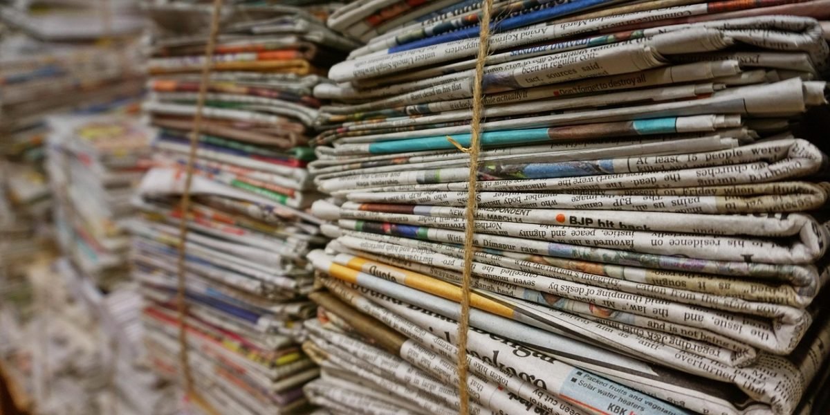 A person looking critically at information, symbolizing skepticism and the need to verify sources against misleading data.
