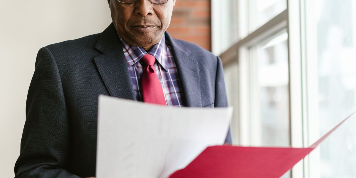 A business leader deep in thought, evaluating complex information to distinguish valuable insights from mere hype.