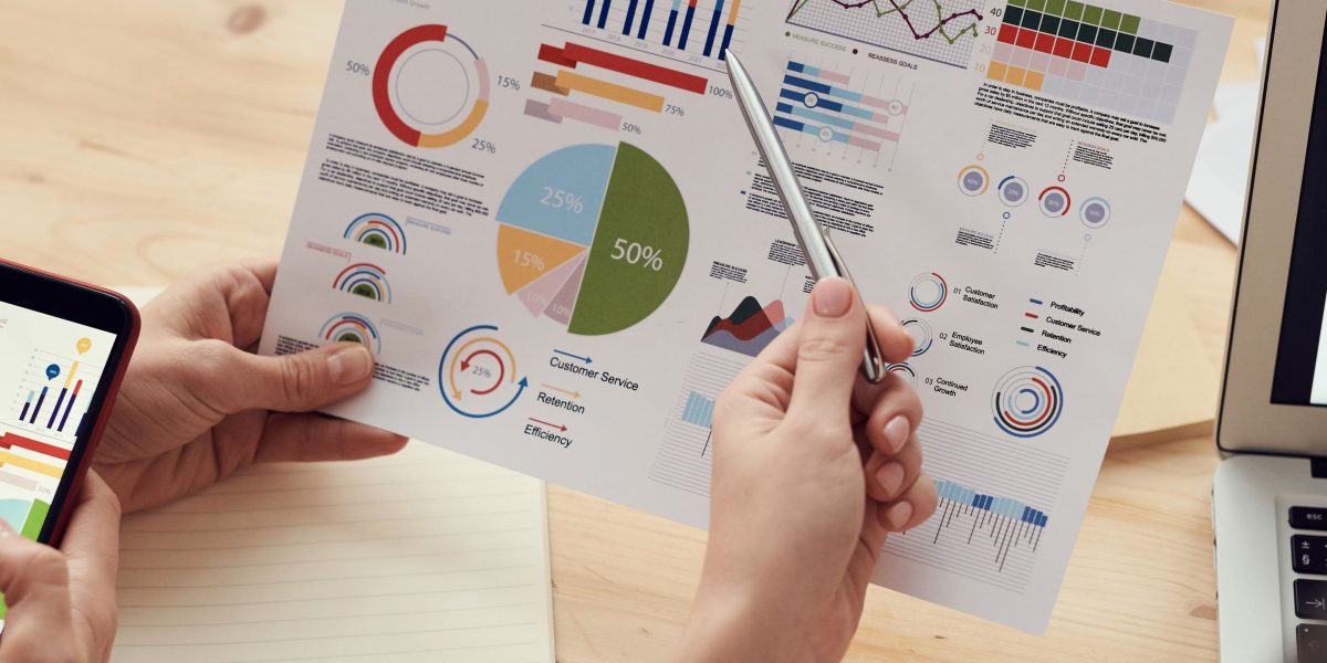 A business professional intently analyzing data visualizations, assessing the tangible return on investment from AI projects.