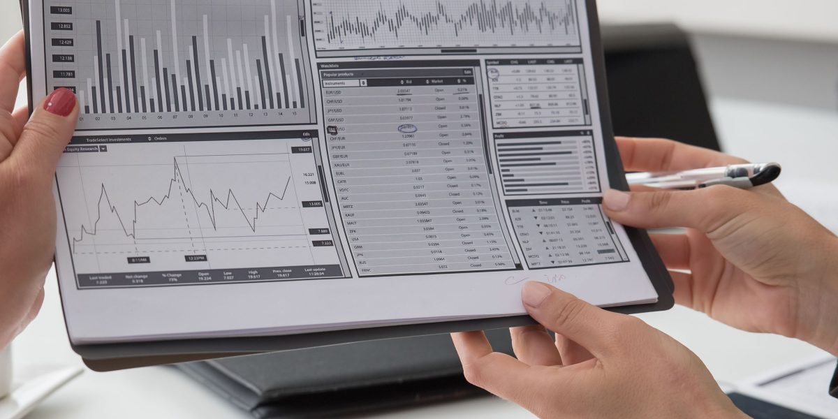 Professionals analyze performance data to validate AI model effectiveness and impact.
