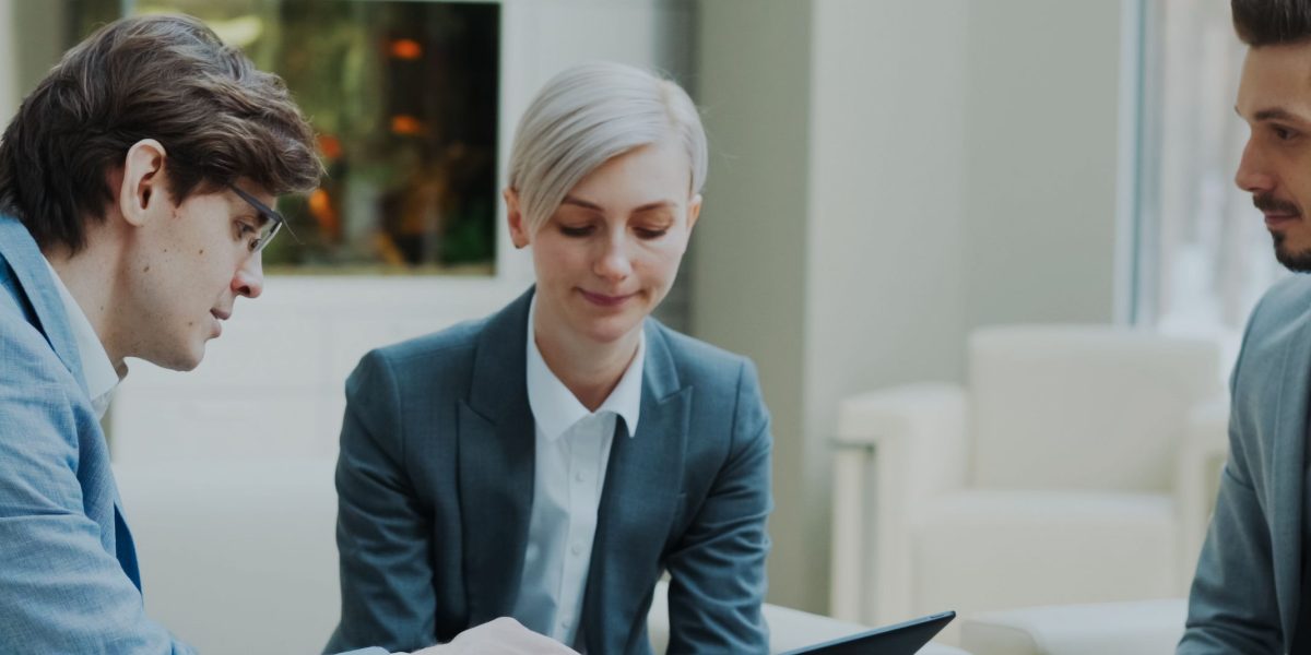 A team of executives collaborating around a table, making strategic decisions by considering various market signals, potential hazards, and new opportunities.